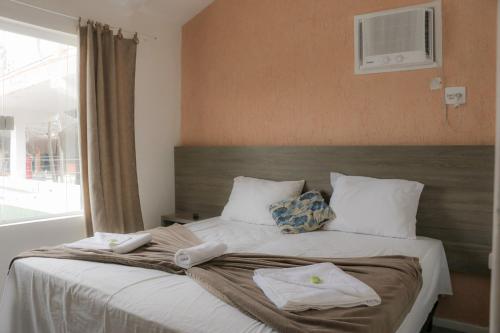 Katil atau katil-katil dalam bilik di Tarumã Búzios Hotel