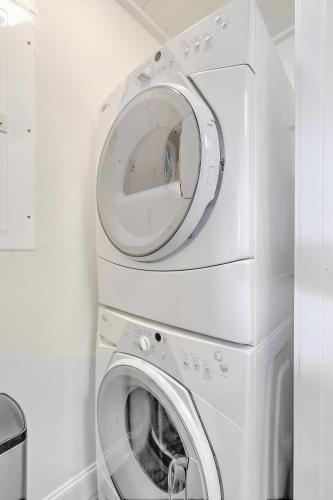 a washer and dryer in a white laundry room at Lagoon Villa 22 - Private Villa! Close Walk to Beach! in Isle of Palms
