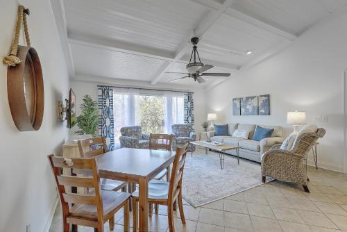 a living room with a table and chairs at Lagoon Villa 22 - Private Villa! Close Walk to Beach! in Isle of Palms