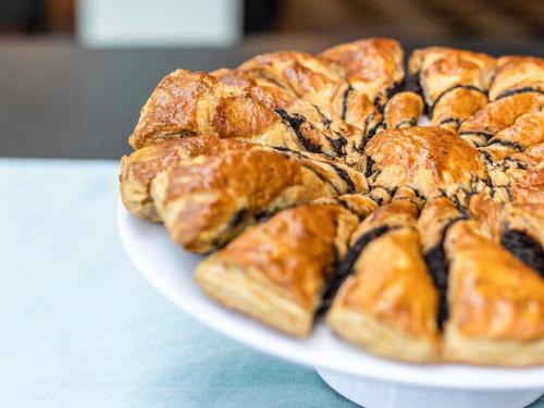 a plate of pastries on top of a table at ibis Styles Bordeaux Centre Mériadeck in Bordeaux