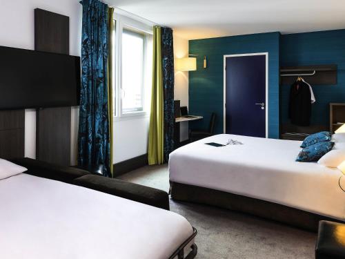 Postel nebo postele na pokoji v ubytování Ibis Styles Lyon Centre - Gare Part Dieu