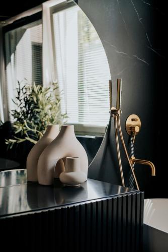 a table with some items on it with a window at By the lake apartment in Ostróda