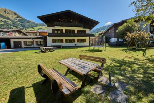a park with a picnic table and a playground at Apartments Enzian in Rauris