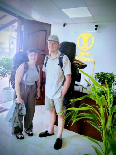 a man and a boy standing in a room at Ryan Residence & Restaurant in Negombo