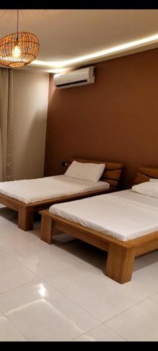 Katil atau katil-katil dalam bilik di B&B Klomiabla