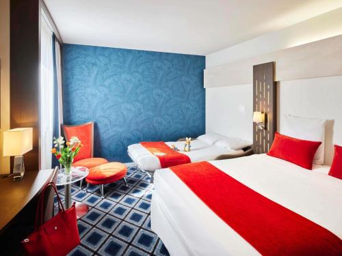 Ένα ή περισσότερα κρεβάτια σε δωμάτιο στο Mercure Chartres Centre Cathedrale