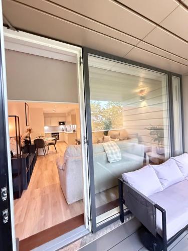 a room with a sliding glass door leading to a living room at Quiet Hideaway in London