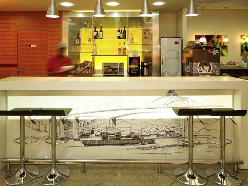 a counter top with a drawing on it in a restaurant at ibis Vitoria Praia de Camburi in Vitória