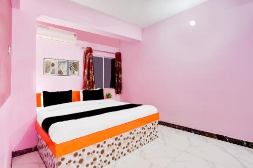 Ένα ή περισσότερα κρεβάτια σε δωμάτιο στο Hotel O The Triotel Inn