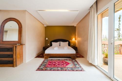 a bedroom with a bed and a window at Villa with Private Garden & Pool Ourika, Atlas Mountains in Sidi Bouzguia