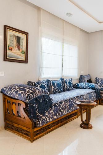 a living room with a couch and a window at Villa with Private Garden & Pool Ourika, Atlas Mountains in Sidi Bouzguia