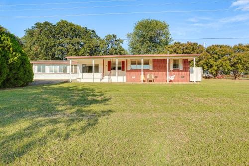 a red brick house with a large yard at Walk to Marina Family Home with Yard in Kingston in Shay