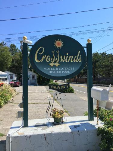 a sign for a restaurant in a parking lot at Crosswinds Motel in Old Orchard Beach