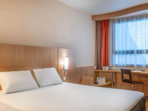 Letto o letti in una camera di Ibis Madrid Centro las Ventas