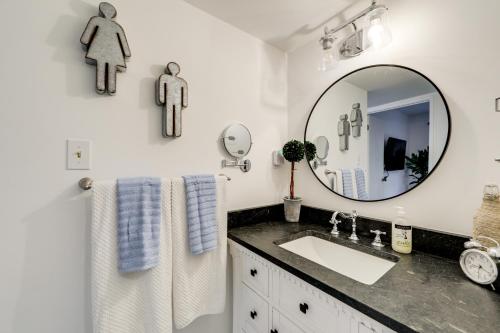 a bathroom with a sink and a mirror at Sevierville Condo with Balcony and Pool Access! in Sevierville
