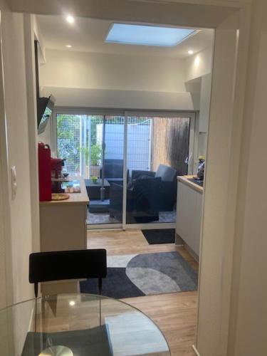 a view of a kitchen and a living room at Studio Jeanine in Le Portel