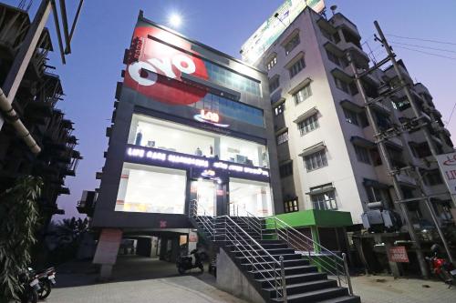 a building with a sign on the side of it at Hotel O Prabha Palace Lodge in Guwahati