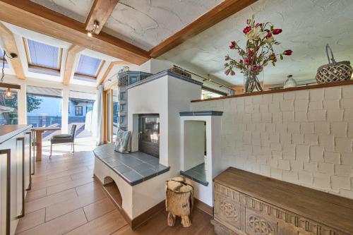 a living room with a fireplace in a house at Apartments Enzian in Rauris