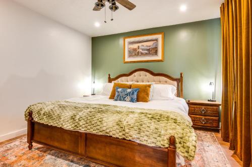 Un dormitorio con una cama grande y una pared verde. en Historic Retreat with Mtn Views in Pioche!, en Pioche