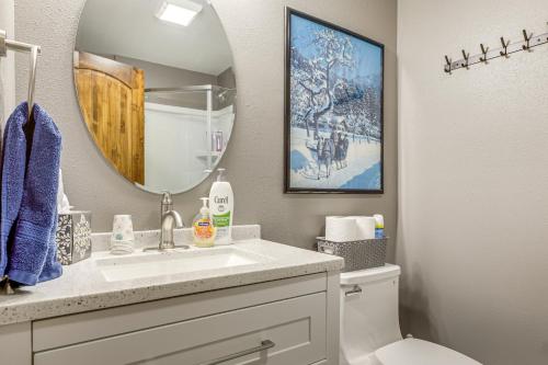 a bathroom with a sink and a mirror at Ski-InandSki-Out Condo in Upson - Walk to Lake in Upson