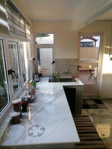 a kitchen with a sink and a counter at Villa Tulip in Trou aux Biches