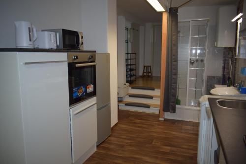 a kitchen with a sink and a stove top oven at Ferienwohnung in Gotha in Gotha