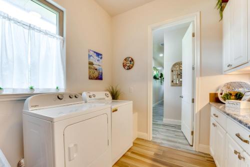 a laundry room with a washer and dryer at Luxe Waterfront Home with Boat Slip in New Braunfels in Schumannsville
