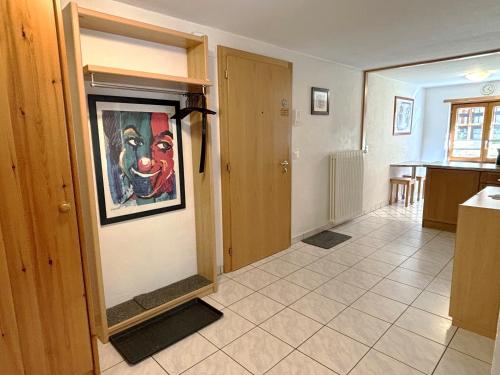 a living room with a painting on the wall at Chalet Medi in Zermatt