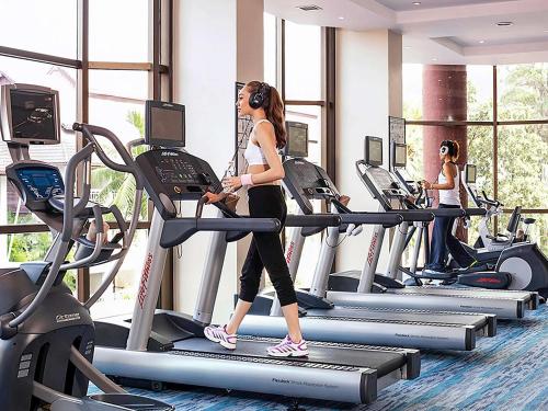 a group of people on treadmills in a gym at Pullman Pattaya Hotel G in Pattaya North