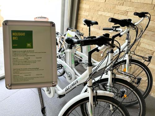 a bunch of bikes parked next to a sign at ibis Styles Catania Acireale in Acireale