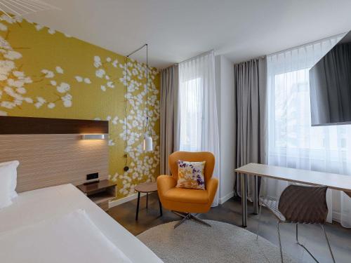 Ένα ή περισσότερα κρεβάτια σε δωμάτιο στο Mercure Hotel Stuttgart Gerlingen
