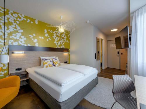 Ένα ή περισσότερα κρεβάτια σε δωμάτιο στο Mercure Hotel Stuttgart Gerlingen