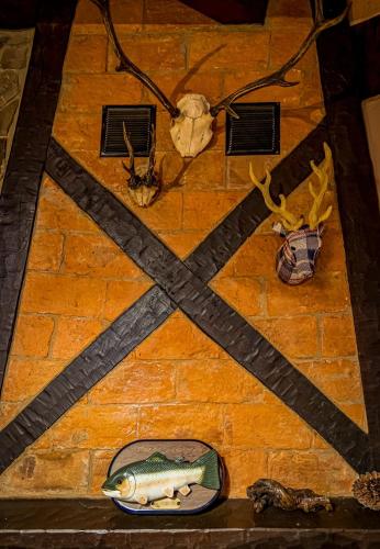 a table with a picture of a fish on it at Casa de piedra en el corazón de Potes in Potes
