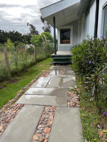 a walkway in front of a house at El ático in Barra de Portezuelo