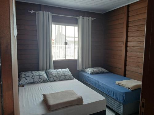 En eller flere senge i et værelse på Casa da Vovó Éte
