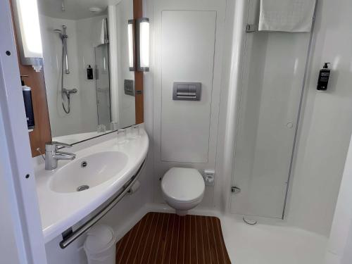 a bathroom with a sink and a toilet and a shower at Ibis Styles Liverpool Centre Dale Street - Cavern Quarter in Liverpool