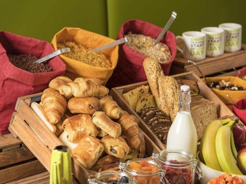 a bunch of different types of bread and other foods at Ibis Styles Liverpool Centre Dale Street - Cavern Quarter in Liverpool