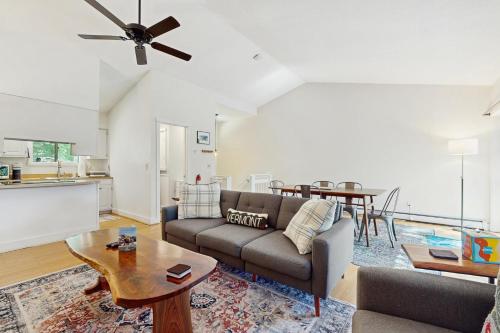 a living room with a couch and a table at Mill Run 3C in Quechee
