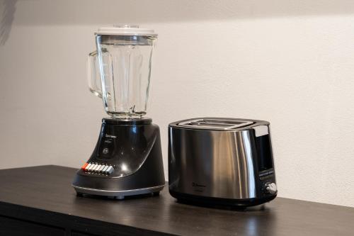 a blender sitting on top of a counter at Zielo Rentals Palma ,Private balcony, Rooftop Walk to Zocalo in Mexico City