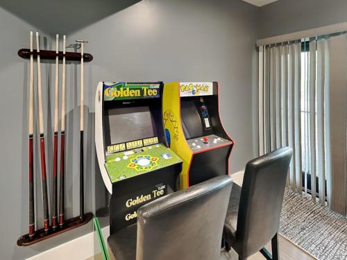 a room with a video game console and two chairs at No Black Tie Affair in McHenry