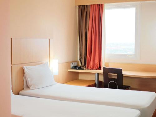 Postel nebo postele na pokoji v ubytování ibis Feira de Santana