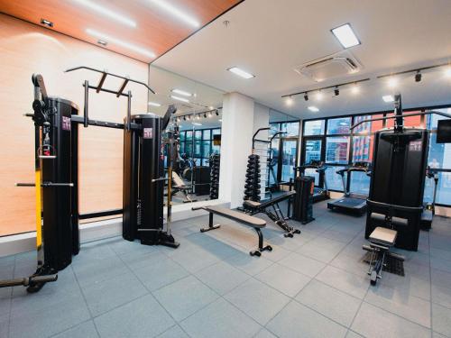 a gym with treadmills and equipment in a building at ibis Curitiba Shopping in Curitiba