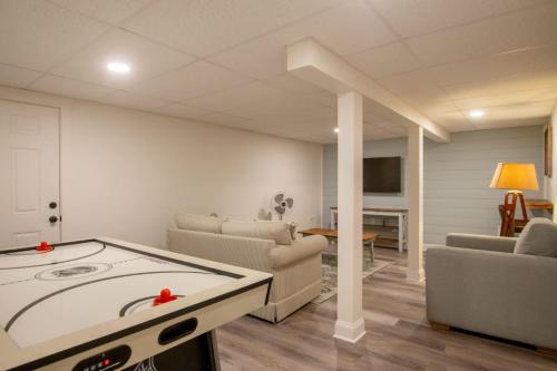 a living room with a pool table in the middle of a room at In-Ground Plunge Pool Dog Friendly! in Brewster
