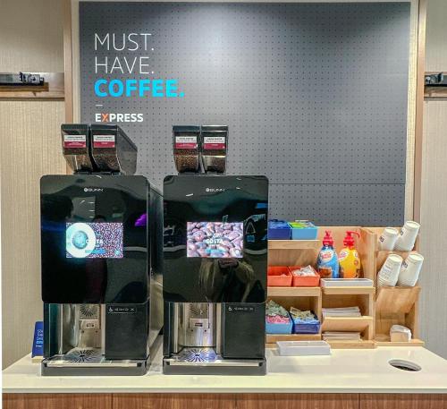 a coffee shop with two espresso machines on a counter at Holiday Inn Express & Suites Truth Or Consequences by IHG in Truth or Consequences