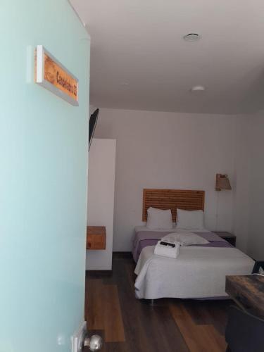 Ένα ή περισσότερα κρεβάτια σε δωμάτιο στο Paracas Guest House