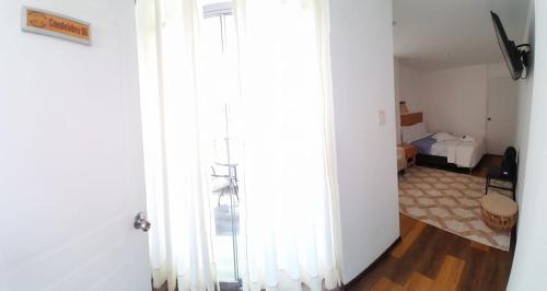 Ένα ή περισσότερα κρεβάτια σε δωμάτιο στο Paracas Guest House