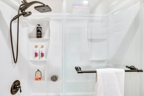 a bathroom with a shower with a glass door at Newly Updated! Commuter-Friendly Anaheim Home in Anaheim