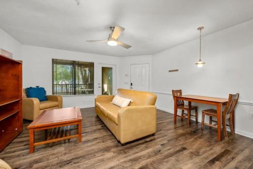 a living room with a couch and a table at Pool Gym & Extended Stays Budget Frienly in Tampa