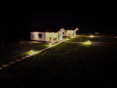 a house at night with lights in the yard at Sunny Apartments in Malo Laole