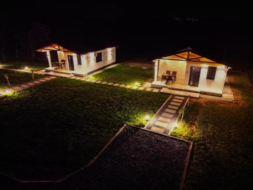an aerial view of a house at night with lights at Sunny Apartments in Malo Laole